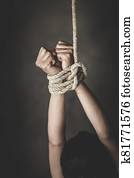 woman hands bound prisoner in room, hands bound, woman's hand tied with a rope, Detainee was detain and hidden by human traffickers, Woman bondage, stop violence against Women.Human rights violations. woman hands bound prisoner in room, hands bound, woman's hand tied with a rope, Detainee was detain and hidden by human traffickers, Woman bondage, stop violence against Women.Human rights violations.