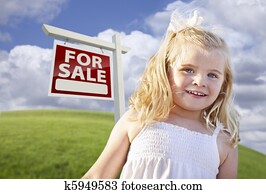 Smiling Cute Girl in Field with For Sale Real Estate Sign Smiling Cute Girl in Field with For Sale Real Estate Sign
