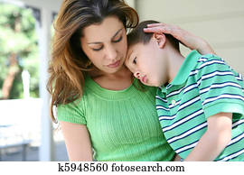 Tired boy at Home with Mother