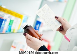 closeup hand of chemist with drug closeup hand of chemist with drug