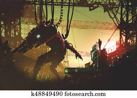 man operating the robot with remote control man operating the robot with remote control