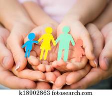 Paper family in hands Paper family in hands