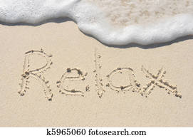 Relax Written in Sand on Beach
