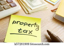 Memo stick with words property tax and money.