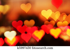 Blurred valentine background with heart-shaped highlights. Blurred valentine background with heart-shaped highlights.