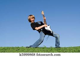 child playing guitar and singing child playing guitar and singing