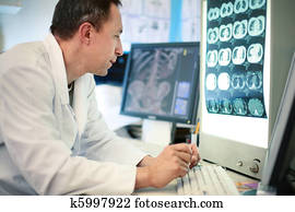 Doctor looking at ct scan