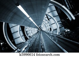 Futuristic architecture. Tunnel with moving sidewalk. Futuristic architecture. Tunnel with moving sidewalk.