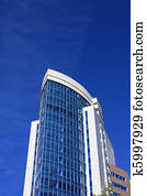 Modern office building over blue sky.
