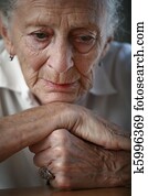 Senior woman pondering. Close-up, shallow DOF, focus on eyes. Senior woman pondering. Close-up, shallow DOF, focus on eyes.