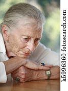 Senior woman pondering. Shallow DOF. Senior woman pondering. Shallow DOF.