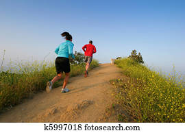 Two people running at Runyon Canyon Park, Hollywood Hills, California USA Two people running at Runyon Canyon Park, Hollywood Hills, California USA