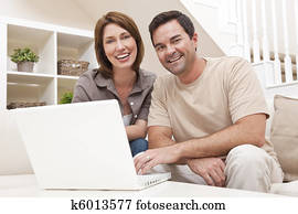 Happy Man Woman Couple Using Laptop Computer At Home