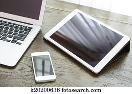 laptop with tablet and smart phone on table laptop with tablet and smart phone on table
