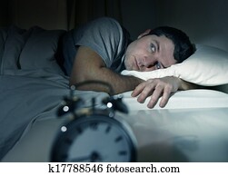 man in bed with eyes opened suffering insomnia and sleep disorder man in bed with eyes opened suffering insomnia and sleep disorder