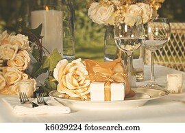 Wedding party favors on plate at reception Wedding party favors on plate at reception