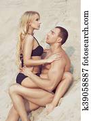 Woman sitting on top of the man. Woman sitting on top of the man.