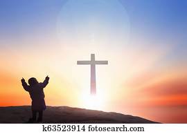 Worship and praise God concept: cross on blurry background