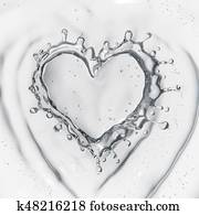 Heart from water splash with bubbles isolated on white Heart from water splash with bubbles isolated on white