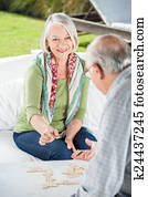 Senior Couple Playing Dominoes Senior Couple Playing Dominoes