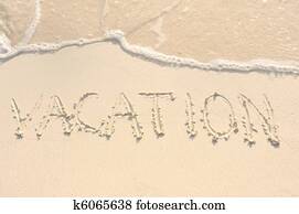Vacation Written in Sand on Beach