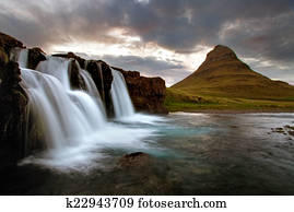 Waterfall with volcano in Iceland Waterfall with volcano in Iceland