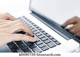 Hands typing on laptop keyboard Hands typing on laptop keyboard