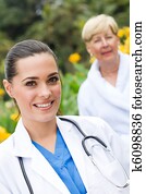 nurse and senior patient outdoors