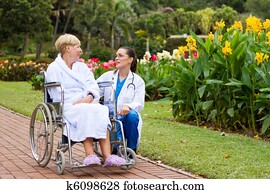 nurse talking to patient outdoors