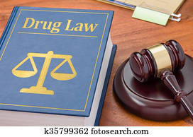 A law book with a gavel - Drug law A law book with a gavel - Drug law