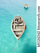 two young boys playing on boat.