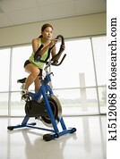 Woman exercising on bike.