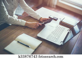 business woman hand working laptop computer on wooden desk.