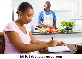 african american couple in kitchen