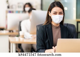 Portrait asian businesswoman working in new normal and social distance office
