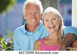 Happy Senior Couple Smiling Outside in Sunshine