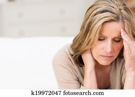 Woman suffering from stress grimacing in pain