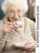 Senior Woman Enjoying Cup Of Tea At Home