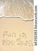 Fun in the Sun Written in Sand on Beach