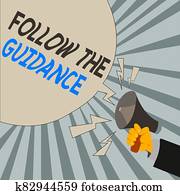 Writing note showing Follow The Guidance. Business photo showcasing controlling a course of projectile by builtin mechanism Male Hu analysis Hand Holding Megaphone Blank Speech Bubble.