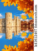 Historic Bodiam Castle with autumn leaves in East Sussex, England