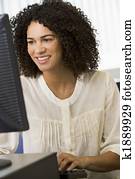 Mid adult woman working on a computer