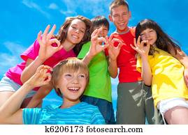 Smiling children's okay signs
