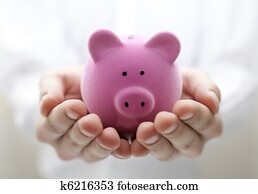 Man holding piggy bank. Shallow DOF