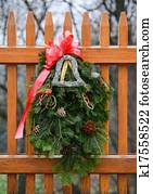 Seasonal Winter Christmas Wreath decoration on a fence Seasonal Winter Christmas Wreath decoration on a fence