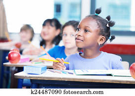 Row of students in a primary interracial classroom. Afro america