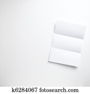 a sheet of blank folded letter paper copyspace on a white background ready for your copy