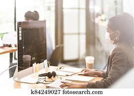 African black asian office worker with face mask in new normal office