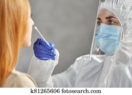 doctor in protective wear making coronavirus test doctor in protective wear making coronavirus test