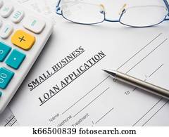 small business loan application on the desk. small business loan application on the desk.